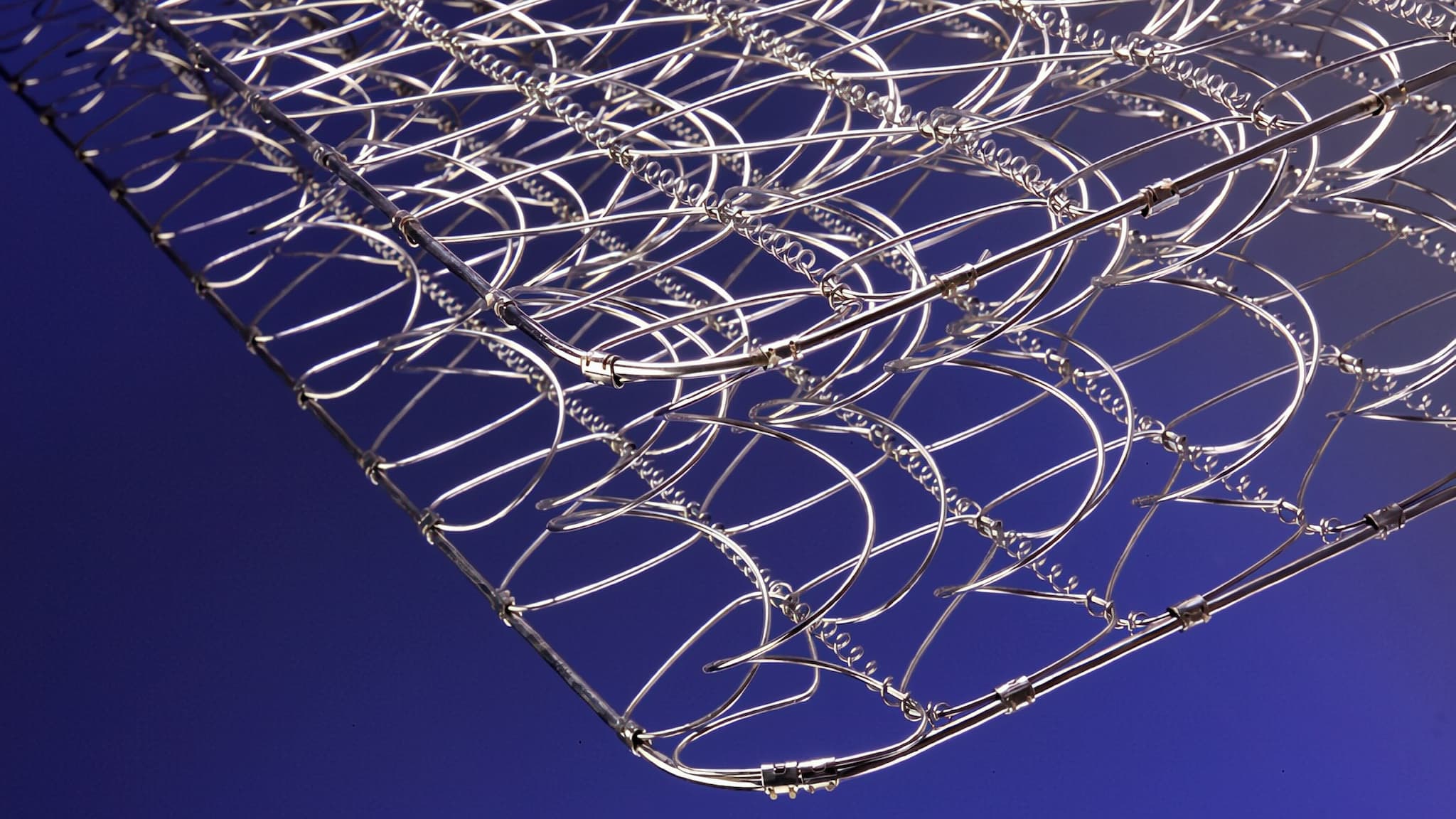 Open coil or continuous coil spring mattresses