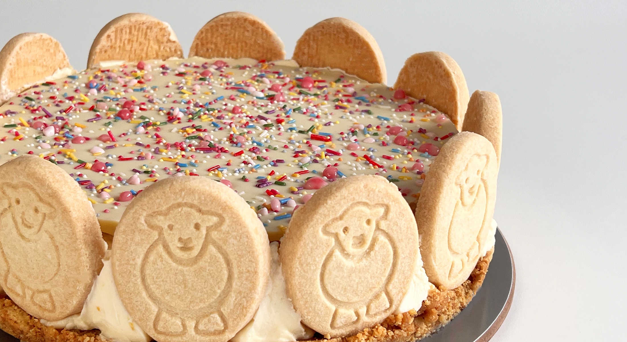 Lemon_Cheesecake landscape Lemon, co bake, cheesecake, with a white chocolate bark and Herdy shortbread